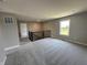 Spacious loft features carpeted floors, a window with natural light, and a wrought iron banister at 12023 Crestwater Ct, Fishers, IN 46037
