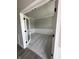 Office room with white base trim, gray walls and carpet, and a glass french door at 12023 Crestwater Ct, Fishers, IN 46037