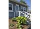 Close up of front entrance with meticulously kept landscaping at 1517 N E St, Elwood, IN 46036