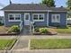 Charming single-story home with well-maintained front yard, steps, and landscaping at 1517 N E St, Elwood, IN 46036