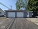 Large two-car garage with driveway, offering ample parking and storage at 1517 N E St, Elwood, IN 46036