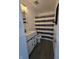 Renovated bathroom featuring a stylish vanity, framed mirror, blue and white striped shower curtain at 6024 Boulder Dr, Anderson, IN 46013