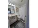 Charming bathroom with a distressed vanity, a medicine cabinet, and a shower-tub combination at 6024 Boulder Dr, Anderson, IN 46013