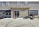 This home features a patio with sliding glass doors, gray siding, and a grill, perfect for outdoor enjoyment at 12997 Bartlett Dr, Fishers, IN 46037