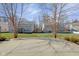 Expansive backyard features a gray-sided home, offering a serene view between mature trees at 12997 Bartlett Dr, Fishers, IN 46037