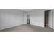 This bedroom has neutral colored walls and carpeting, and an open closet at 12997 Bartlett Dr, Fishers, IN 46037