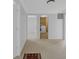 Bedroom with neutral carpet, connecting to a laundry area and additional rooms at 12997 Bartlett Dr, Fishers, IN 46037