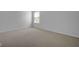 This bedroom has neutral colored walls and carpeting, and a window with blinds at 12997 Bartlett Dr, Fishers, IN 46037