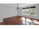 Open dining area with hardwood flooring, traditional chandelier and lots of natural light at 12997 Bartlett Dr, Fishers, IN 46037