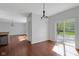 Dining area features hardwood floors and a sliding door to the outdoor patio at 12997 Bartlett Dr, Fishers, IN 46037