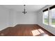 Bright dining room featuring hardwood floors, a chandelier, and natural light at 12997 Bartlett Dr, Fishers, IN 46037
