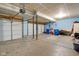 Spacious garage area featuring concrete floors and multiple garage doors at 12997 Bartlett Dr, Fishers, IN 46037