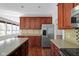Open concept kitchen features stainless steel appliances and plenty of cabinet space at 12997 Bartlett Dr, Fishers, IN 46037