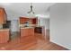 Stylish kitchen with wooden cabinets, island, and hardwood floors at 12997 Bartlett Dr, Fishers, IN 46037
