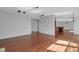Spacious living area with hardwood floors, seamlessly connecting to other living spaces at 12997 Bartlett Dr, Fishers, IN 46037