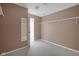 Walk-in closet featuring tan walls, carpet flooring, shelving, and a doorway leading to another room at 12997 Bartlett Dr, Fishers, IN 46037