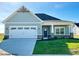 Proposed build of charming one-story home with light blue siding, white trim, and a two-car garage at 1684 Linden Ln, Greenfield, IN 46140