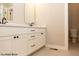 Double vanity bathroom with white cabinets, black hardware, and tile flooring at 1732 Linden Ln, Greenfield, IN 46140