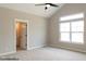 Spacious bedroom with vaulted ceiling, large window, and en-suite bathroom at 1732 Linden Ln, Greenfield, IN 46140