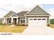 Craftsman style home with gray siding, white trim, and a two-car garage at 1732 Linden Ln, Greenfield, IN 46140