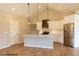 Modern kitchen with white cabinets, stainless steel appliances, and a large island at 1732 Linden Ln, Greenfield, IN 46140
