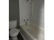 Functional bathroom with a toilet and a clean shower-tub combo, offering essential bathing facilities at 2270 Wheeler St, Indianapolis, IN 46218