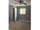 Relax in the spacious bedroom featuring a ceiling fan, window, closet, and plush carpeting at 2270 Wheeler St, Indianapolis, IN 46218