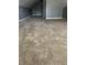 The large empty room boasts ample space and new carpet flooring at 2270 Wheeler St, Indianapolis, IN 46218