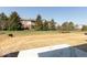 Spacious backyard showing grass and partial view of apartment building at 7370 Broadview Ln, McCordsville, IN 46055