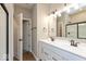 Bathroom features double sinks, lots of mirror lighting, and a glass shower at 7370 Broadview Ln, McCordsville, IN 46055