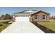 Lovely brick home with attached two-car garage and manicured front lawn at 7370 Broadview Ln, McCordsville, IN 46055