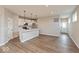 Spacious open-concept kitchen with a breakfast bar, stainless steel appliances, hardwood floors, and lots of light at 7370 Broadview Ln, McCordsville, IN 46055