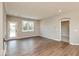 Open living room boasts wood floors, recessed lighting, and access to the outside at 7370 Broadview Ln, McCordsville, IN 46055