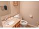 Cozy bathroom featuring a single sink vanity with a granite countertop and a standard toilet setup at 9563 England Ct, Noblesville, IN 46060