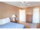 Cozy bedroom featuring a ceiling fan, neutral walls, and classic wood furnishings at 9563 England Ct, Noblesville, IN 46060