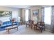 Cozy living room featuring comfortable seating, floral-patterned curtains, and tasteful artwork at 9563 England Ct, Noblesville, IN 46060