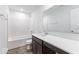Bright bathroom features a white vanity, white tiled shower and modern fixtures at 1145 Bevy Blvd, Danville, IN 46122