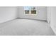 Bright bedroom with carpet floors and natural light from double windows at 1145 Bevy Blvd, Danville, IN 46122
