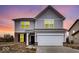 Two-story home with grey siding, brick accents, and an attached two-car garage at 1145 Bevy Blvd, Danville, IN 46122