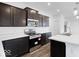 Well-equipped kitchen with stainless steel appliances, dark cabinets, and a center island at 1145 Bevy Blvd, Danville, IN 46122