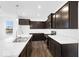 Stylish kitchen with stainless appliances, dark cabinetry, and marble countertops at 1145 Bevy Blvd, Danville, IN 46122