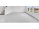 Cozy room featuring gray carpet, natural light, and backyard views at 1145 Bevy Blvd, Danville, IN 46122