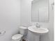 Modern powder room with pedestal sink and stylish mirror at 1145 Bevy Blvd, Danville, IN 46122