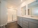 Well-lit bathroom featuring double vanity and glass-enclosed shower at 1567 Hanover St, Danville, IN 46122