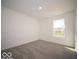 Inviting bedroom filled with natural light showcasing a plush carpet and window at 1567 Hanover St, Danville, IN 46122