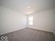 Simple bedroom featuring neutral carpet and a sunlit window at 1567 Hanover St, Danville, IN 46122