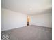 Large bedroom with soft carpet, neutral walls and bathroom access at 1567 Hanover St, Danville, IN 46122