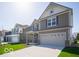 Attractive two-story home featuring a two-car garage and professionally landscaped front yard at 1567 Hanover St, Danville, IN 46122