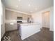 Modern kitchen features a large island, stainless steel appliances, and ample cabinet space for storage at 1567 Hanover St, Danville, IN 46122