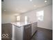 Bright and airy kitchen featuring a center island with sink and dishwasher in a modern layout at 1567 Hanover St, Danville, IN 46122